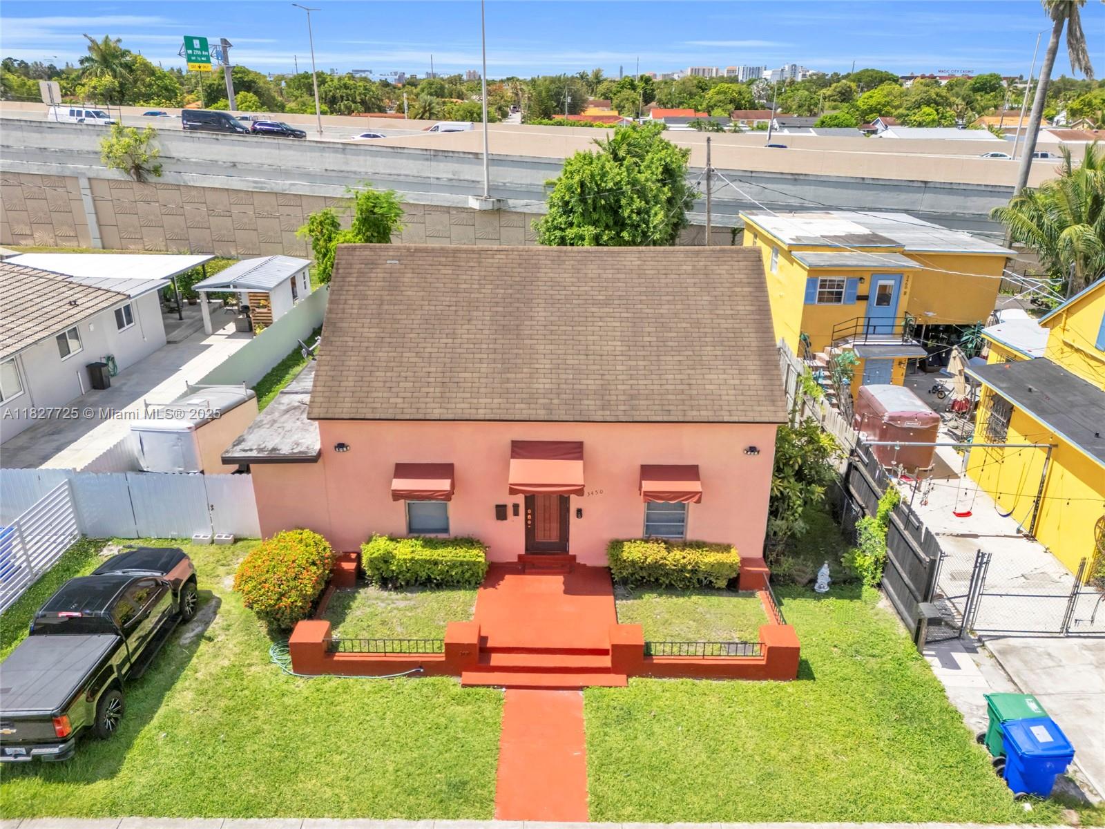 Centrally located in the desirable Grapeland Heights Estates, this charming 2-bedroom, 2-bath single-family home offers great potential for investors or owner-occupants looking to customize and add value. Just blocks from the site of the new Miami Freedom Park & Soccer Village — future home of Inter Miami and host to the 2026 World Cup — this area will feature a 58-acre public park and over 500,000?sq.?ft. of retail and entertainment. Ideally located only 7?miles from Miami International Airport, a block from the 836 Expressway, and just 10?minutes from Downtown, this home is close to Magic City Casino, beaches, and major transportation routes. Enjoy an inviting front porch and a large, private backyard — a perfect space to create your own outdoor oasis.
