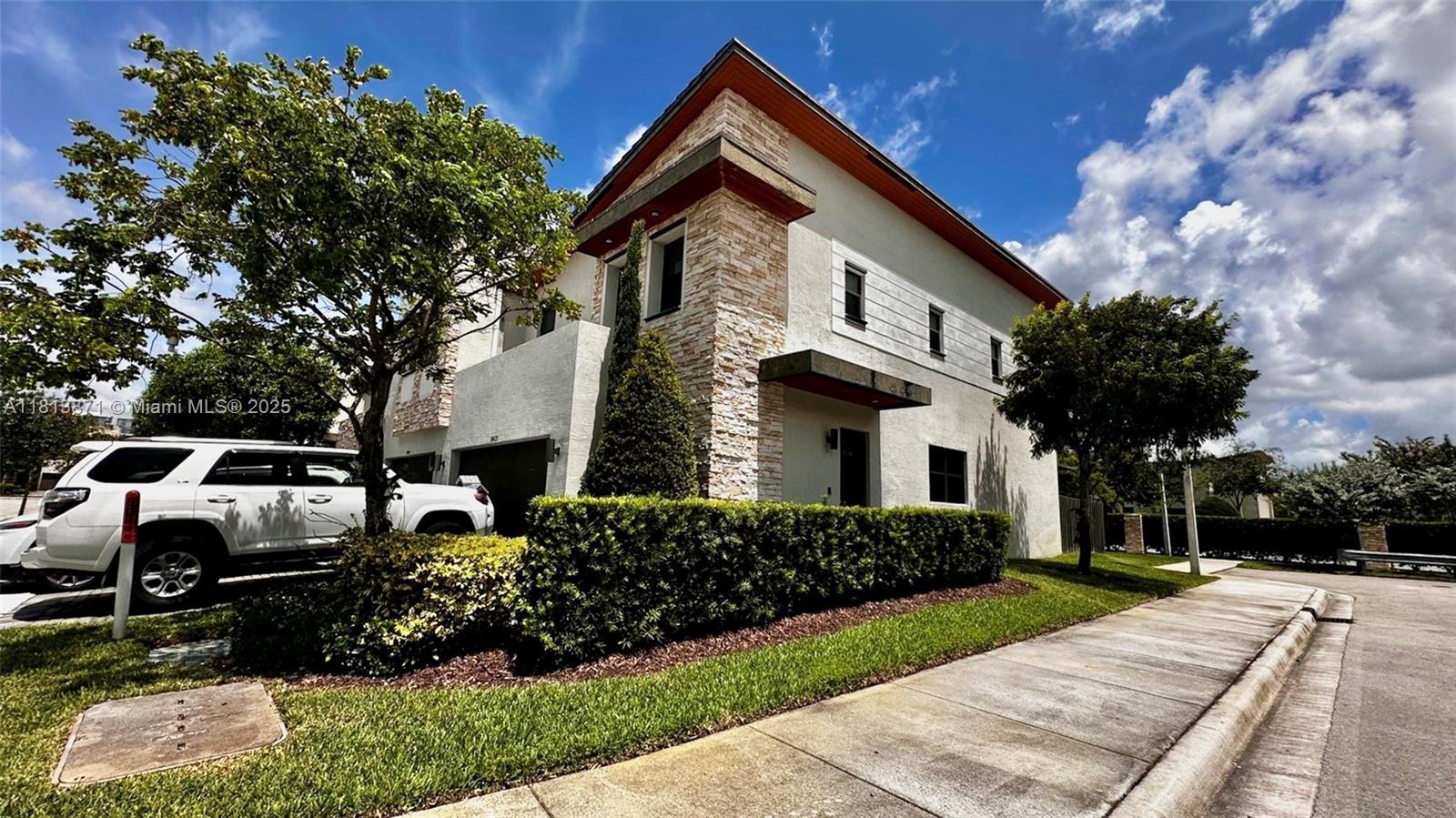 Stunning corner townhouse, one of the largest units in the community. Located on a wide street. Features a charming patio with pergola, additional green area behind the property, and beautiful decorative lighting. Marble floors downstairs and ceramic upstairs (not original). Well-maintained and located in an excellent neighborhood. Resort-style amenities: the largest pool in Doral, full gym, tennis and basketball courts, barbecue area, clubhouse, party room and more. Top-rated schools, shopping centers, Publix, TJ Maxx, restaurants, and more nearby. Excellent location!