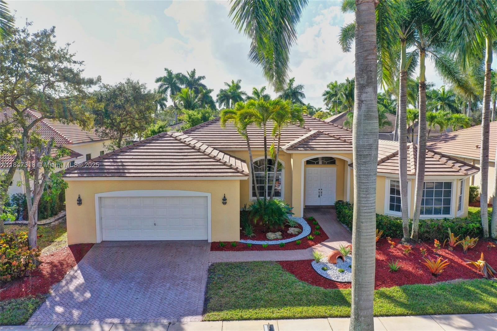 Welcome home to this bright & spacious one story home in the prestigious Weston Hills CC. The house features a 3 way split floor plan for most privacy, with 5 bedrooms plus an ADDITIONAL OFFICE with built-in shelves and 3 full baths. Expansive social areas for entertaining including a gorgeous screened patio and pool. SS appliances, new beautiful light fixture, bathroom fixtures and window treatments. Porcelain ceramic tile floors throughout and laminated flooring in bedrooms. Lots of storage including a walk-in pantry. Laundry room with sink. Oversized two car garage. Weston's "A" rated schools: Gator Run Elementary, Falcon Cove Middle, Cypress Bay High School. Located in the heart of Weston with easy highway access (I-75).