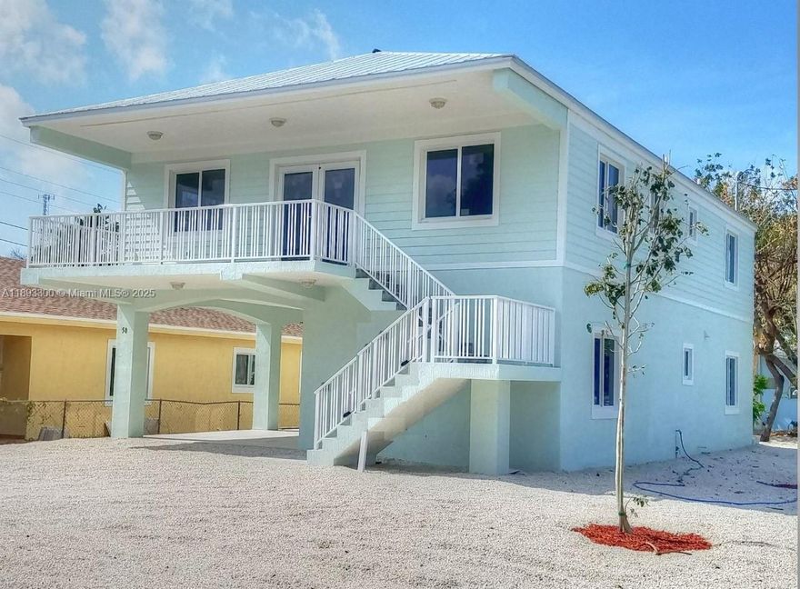 Newer beautiful corner 2 bedroom 1 bath on ground level of single family home.  No stairs.  tiled throughout.  Impact windows and doors.  Nice backyard.  Electric and water included up to $225 per month. Private homeowners park with beach, picnic area, tiki and boat ramp close by.  Located at mile marker 100.  Very quiet area near schools, shopping, restaurants and more.