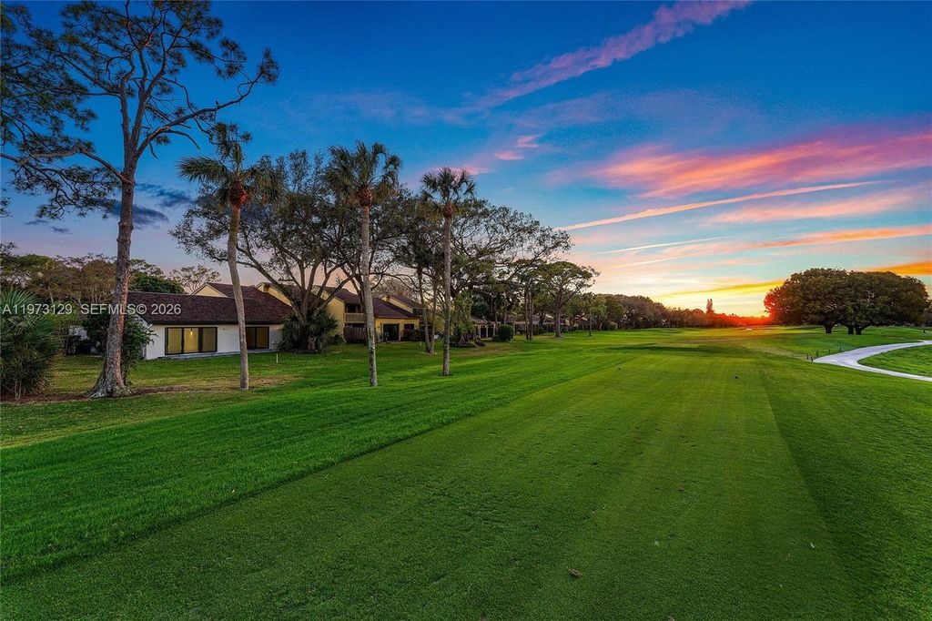 Photo of 2007 Deer Creek Woodlands Way, Deerfield Beach, FL 33442 (MLS # A11973129)