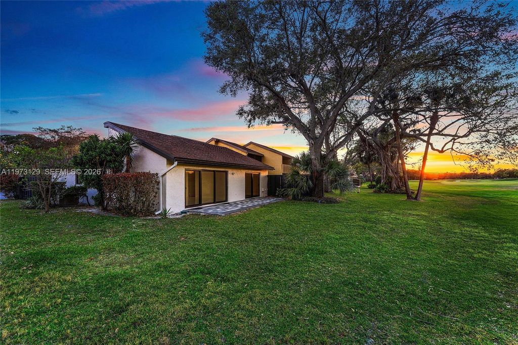 Photo of 2007 Deer Creek Woodlands Way, Deerfield Beach, FL 33442 (MLS # A11973129)