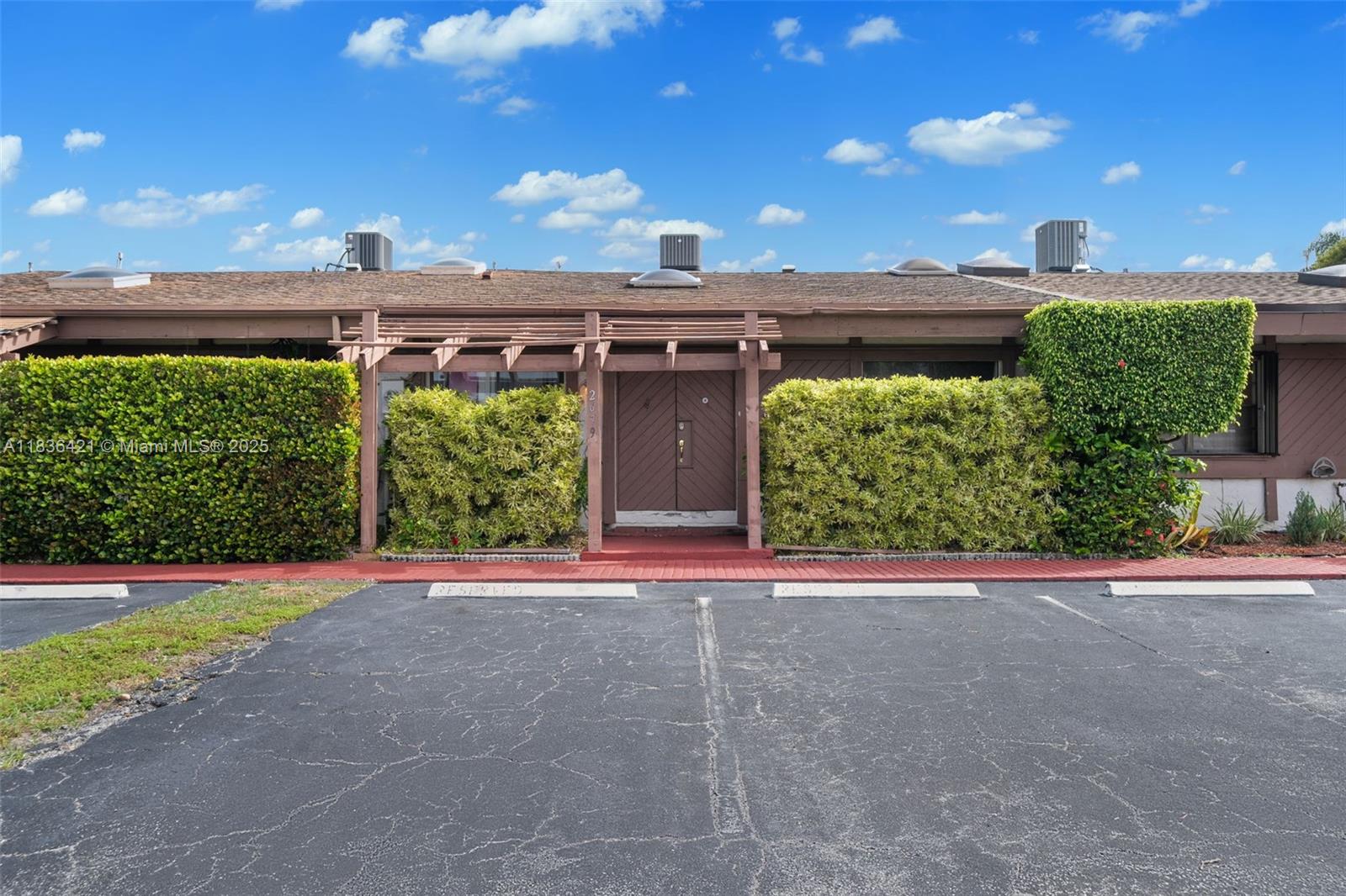 pacious and beautifully maintained 2-bedroom, 2-bath villa offering 1,688 sq ft of living space with a desirable split floor plan. Enjoy your own private yard and atrium, perfect for relaxing or entertaining. Conveniently located just minutes from major shopping centers including Walmart, Publix, Walgreens, CVS, and more. Only 20 minutes to Fort Lauderdale Airport and a quick 5-minute drive to the beach and Three Island Kids Park.
This home features two dedicated parking spaces right at your doorstep, a brand new refrigerator, and in-unit washer and dryer for your convenience. The community offers resort-style amenities including a swimming pool, tennis court, and sauna. Cable and internet are included in the maintenance fee. Leasing is permitted in the first year. Easy to show