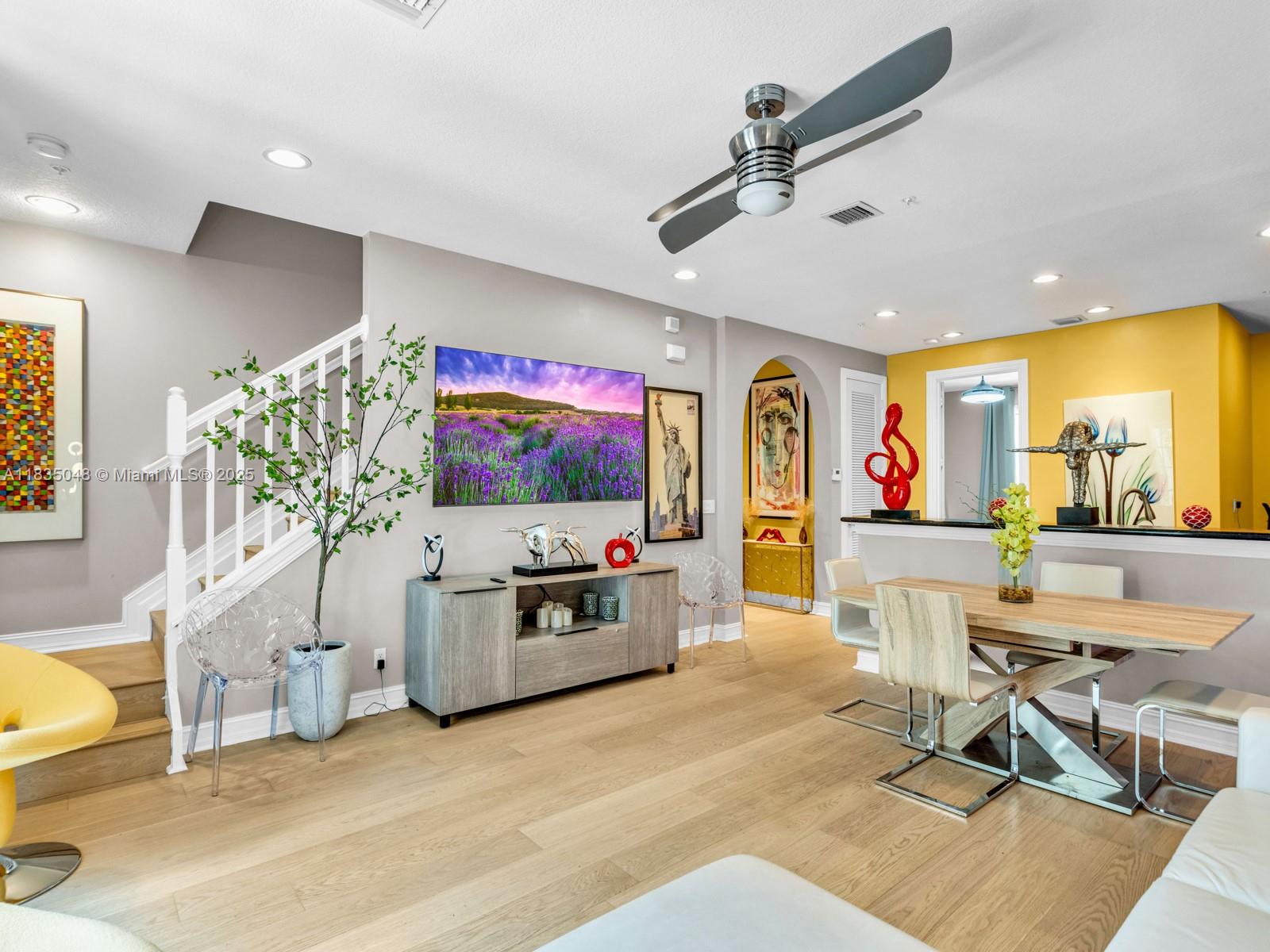 Spacious 3BD/3BA + den/office townhome in desirable Belle Isle, Wilton Manors. This bright 3-story unit features engineered hardwood floors, impact windows & doors, and a flexible 1st-floor space- perfect for an office, studio, den, or extra bedroom. Open 2nd floor includes living & dining areas, modern kitchen w LG stainless steel appliances and a balcony overlooking pool and garden - perfect for evening relaxation. Primary bedroom offers walk-in custom closet & en-suite bath. 2 car garage with custom storage racks + ample guest parking. Community features heated pool, lush landscaping, underground utilities, and pet-friendly policies. HOA includes ADT security and smoke detection, with strong reserves. Prime location just steps to Wilton Drive - walk to shop, dining, and nightlife.