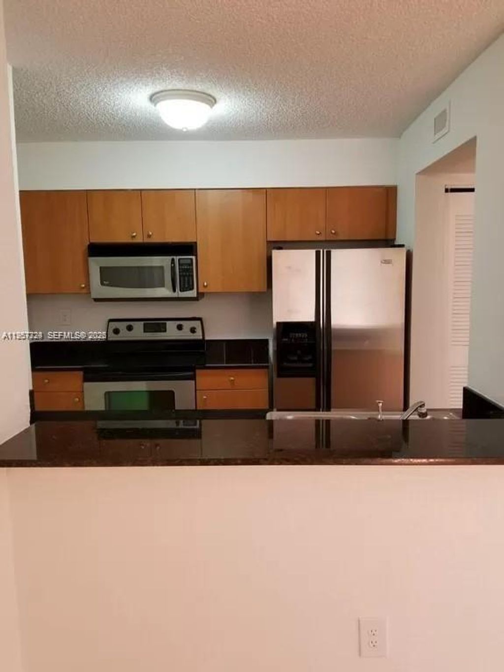 Photo of 2890 N Oakland Forest Dr #111, Oakland Park, FL 33309 (MLS # A11957324)