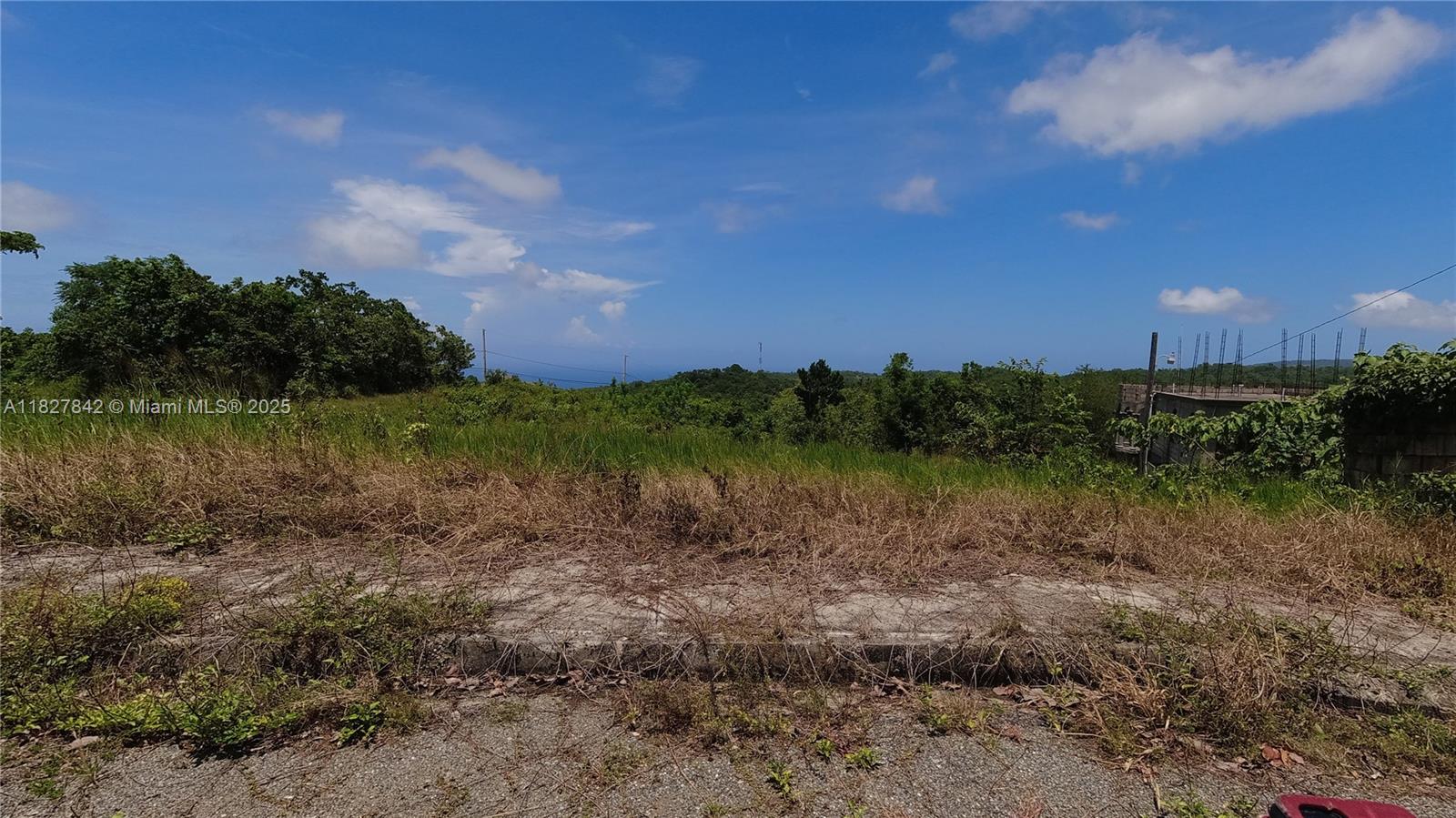 LOVELY CLEARED LOT ,1/4 ACRE LOT N MINARD PENN, WITH OCEAN VIEWS, NEAR BROWNS TOWN ,ST.ANN. PROPERTY HAS EXISTING ELECTRICTY ,LARGE BEAUTIFUL HOMES ALREADY BUILT IN THE COMMUNITY, LOT IS READY TO BUILD YOUR DREAM HOME, PROPERTY TAX OWED SINCE 2018, WILL BE PAID BY SELLER BEFORE CLOSING