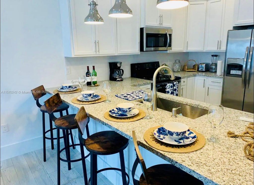 Photo of 667 SW Cleveland Ave #3, Stuart, FL 34994 (MLS # A11570242)