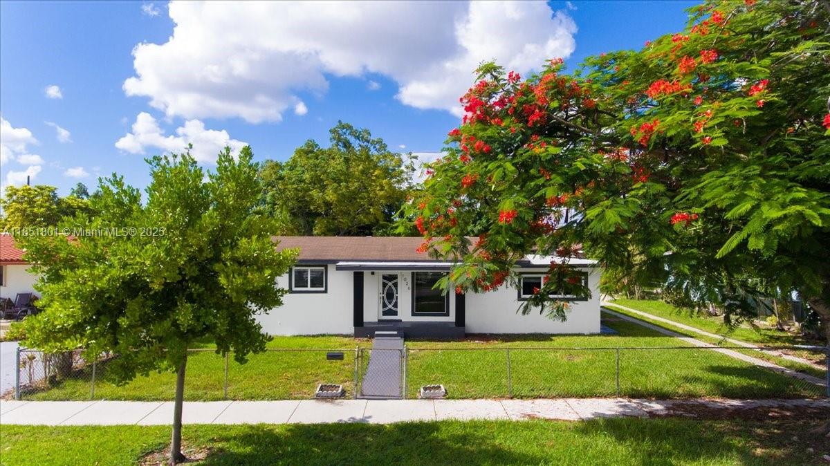 Beautifully renovated 4-bedroom, 2-bath single-family home with NO HOA and incredible income potential! Property is legally recognized as a two-living Units , Zoned multifamily. Detached garage can be easily converted into two efficiency units or a nice 2 bedroom apartment with it's own terrace, patio area—perfect for extra rental income, a large family or guest use. Spacious layout, modern finishes, and oversized backyard over a 1/4 of acre with room for a pool or outdoor kitchen. Ideal for investors or end-users looking for flexibility and added value. Rare opportunity with endless potential!