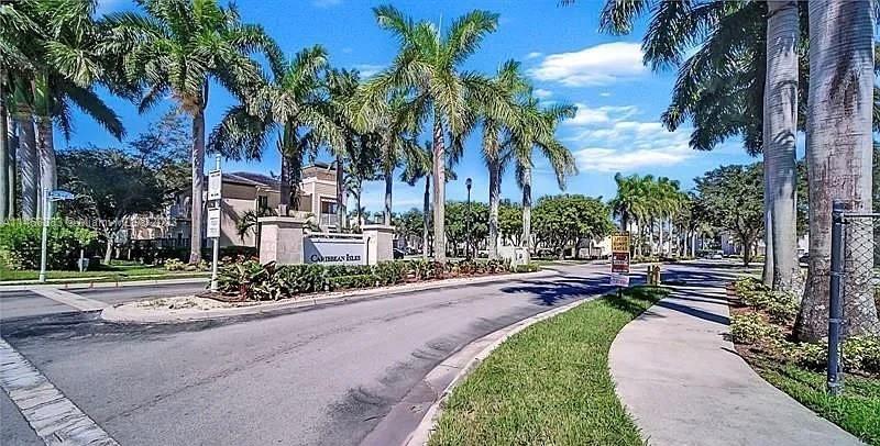 First floor two-bedroom two bathroom in gated community of Caribbean Isles in Homestead, FL. Unit features tile flooring throughout, washer/dryer in the unit & fenced in patio space. Primary bedroom fits a king size bed and has good closet space. One parking space plus plenty of guest parking. Community has a large pool and nice gym.