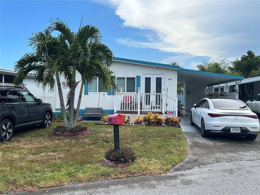 Beautifully maintained 2-bedroom, 2-bathroom mobile home in the Ravenswood Gardens community of Dania Beach. This charming residence features an upgraded kitchen, a new A/C (2023), and recently installed front windows. The home also includes a convenient laundry room with a full-size washer and dryer. Enjoy added peace of mind that comes with land ownership. With no association fees, this move-in-ready property offers excellent value and long-term stability.