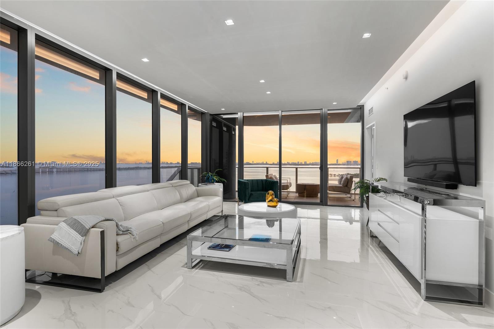 Turnkey and move-in ready, this fully furnished residence with $100K+ in designer upgrades is perfectly positioned on the 12 floor, high enough for sweeping panoramas yet low enough to feel right on the water. Enjoy unobstructed bay, ocean, and skyline views that flow seamlessly from sunrise to sunset in this 4-bedroom + den, 5.5 bath home with maid’s quarters. Custom closets, blinds, and dual private elevator entry add to the elevated living experience. Floor-to-ceiling windows bathe each room in natural light, while spa-style en-suites create a retreat for every bedroom. Aria Reserve, Miami’s largest waterfront residential site, offers 2 acres of resort-style amenities including 3 pools, spa, fitness center, tennis, paddleball, basketball, theater, dog park, kid’s splash pad, and more.