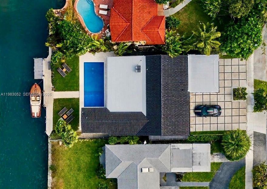Bisacayne Point Turnkey perfection on the water. Completely remodeled in 2024 by an Italian designer.

Every surface, every system, every detail renewed. 
This stunning 4BD/4BA canal-front home offers 60 feet of direct waterfront with ocean access, a private dock, new seawall, and a 20,000 lb boat lift. 

Close to 2,700 SF of bright, fluid interiors have been reimagined from the ground up: new roof, plumbing, AC, and impact windows throughout, complemented by designer finishes and a chef's kitchen with an oversized island perfect for entertaining. 
The open layout flows seamlessly to a 9,000 SF lot featuring a resort-style pool and fully equipped summer kitchen, made for year-round living under the Miami sky. A walk-in pantry, dedicated laundry room, and generous parking leave nothing to be desired. 

Located in Biscayne Point, one of Miami Beach's rarest addresses — a private, gated island community steps from the ocean, with security patrol and an intimate neighborhood character that sets it apart from anywhere else in the city. Here, the energy of Miami Beach meets the peace of a true waterfront enclave. Move in and live. No compromises.