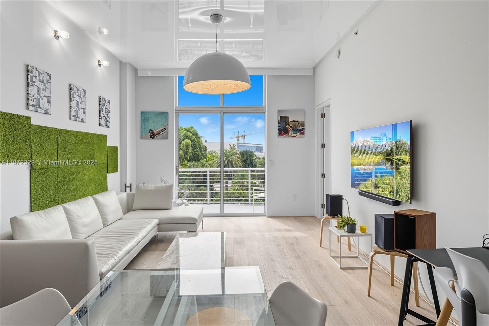 Experience modern elegance in this meticulously renovated 1-bedroom residence at 2001 Meridian. Sunlight fills the space through large windows, highlighting 11.5-foot ceilings and an open layout. The chef’s kitchen features Miele appliances, Sub-Zero and Monogram refrigerators, and custom cabinetry. Bathrooms are luxuriously appointed with Duravit, Toto, and AXOR fixtures and custom lacquer drawers. Thoughtful details continue with custom closets, shelving, a Maytag washer and dryer, ample storage, and dedicated parking. Residents enjoy a 24-hour doorman, rooftop pool and hot tub, and a fully equipped gym, all just steps from Lincoln Road, Sunset Harbour, the beach, and the Miami Beach Botanical Garden. Sophistication and convenience combine seamlessly in this exceptional home.