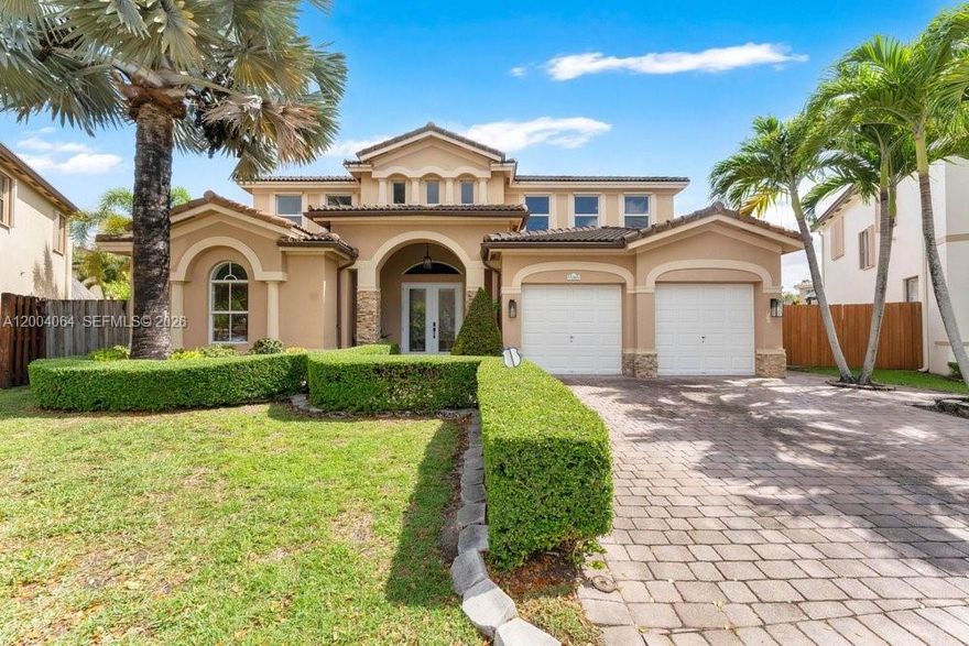 Beautiful and well kept two-story Mediterranean-style home in the highly desirable Century Gardens at Kendall. This house features formal living and dining areas, plus a spacious kitchen with top-of-the-line stainless steel appliances overlooking the backyard. Step outside to your own private oasis with a pool and jacuzzi, perfect for entertaining family and guests. The first floor includes one bedroom ideal for guests or multi-generational living.
Upstairs, you will find three bedrooms plus a den that is now  home office. The oversized primary suite offers  2 walk-in closet and a luxurious bathroom with dual sinks, a separate shower, and a Roman tub.  Additional highlights include a converted garage, two A/C units, water purification system, impact windows, and many more upgrades. Conveniently located near London Square, with shopping, dining, and everyday essentials just minutes away. Low HOA.