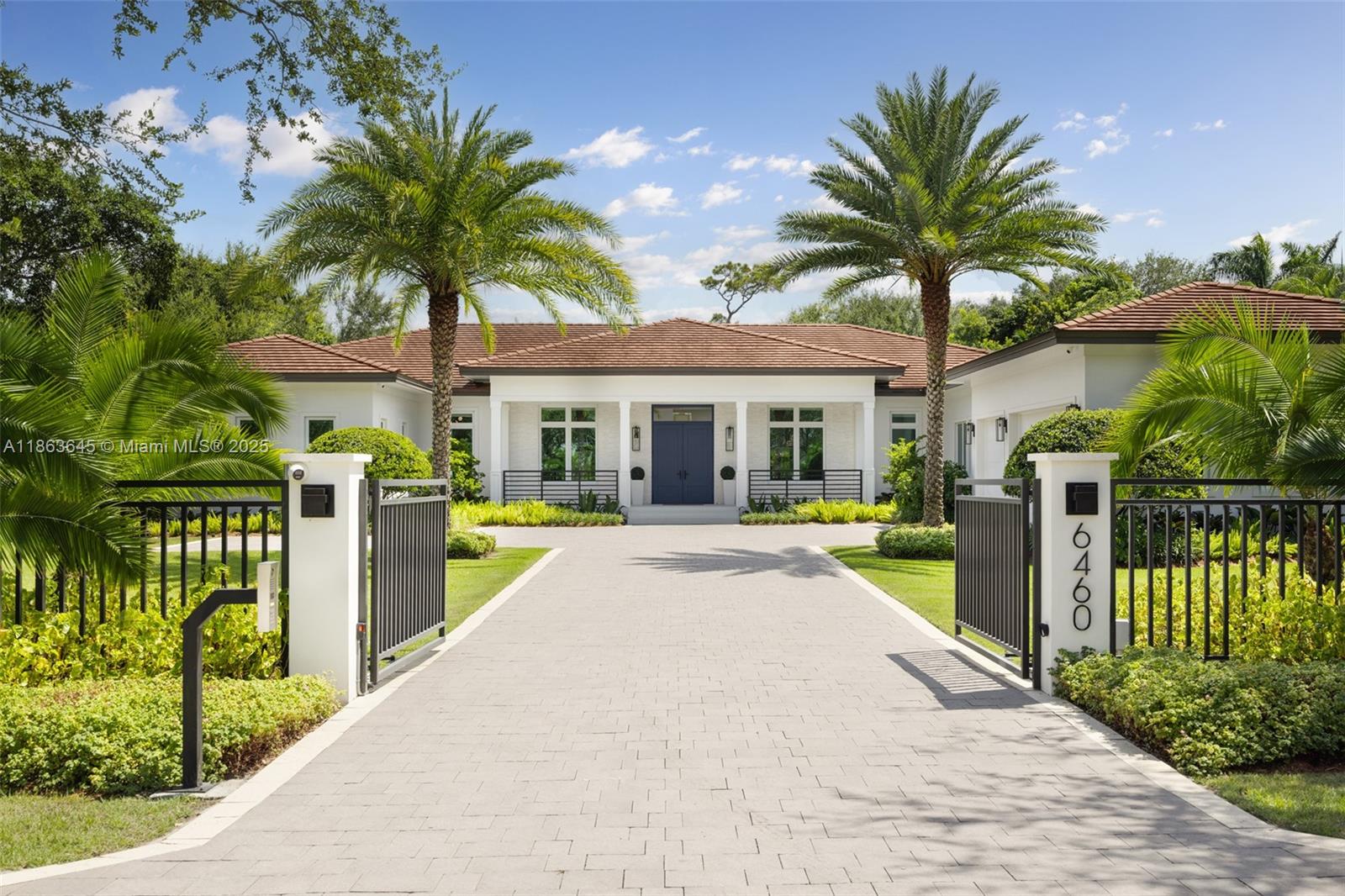 This residence radiates style and quiet luxury. Custom design in collaboration with Hollub Homes, it reflects exceptional craftsmanship, timeless design, and thoughtful livability. On an ultra-quiet street, this home features glass walls with captivating views to a perfectly curated and manicured pool lawn area, sprawling palms, and a Podocarpus hedge that perfectly lines the perimeter. An open kitchen with dual islands anchors everyday life and entertaining. The bedroom wing keeps the family connected, with a dedicated lounge area for time with friends. The smartly designed professional and wellness wing includes a private office, gym with separate entrance, flex workspace, and laundry room. Every detail was intentional—elevated yet welcoming, from first impression to everyday living.