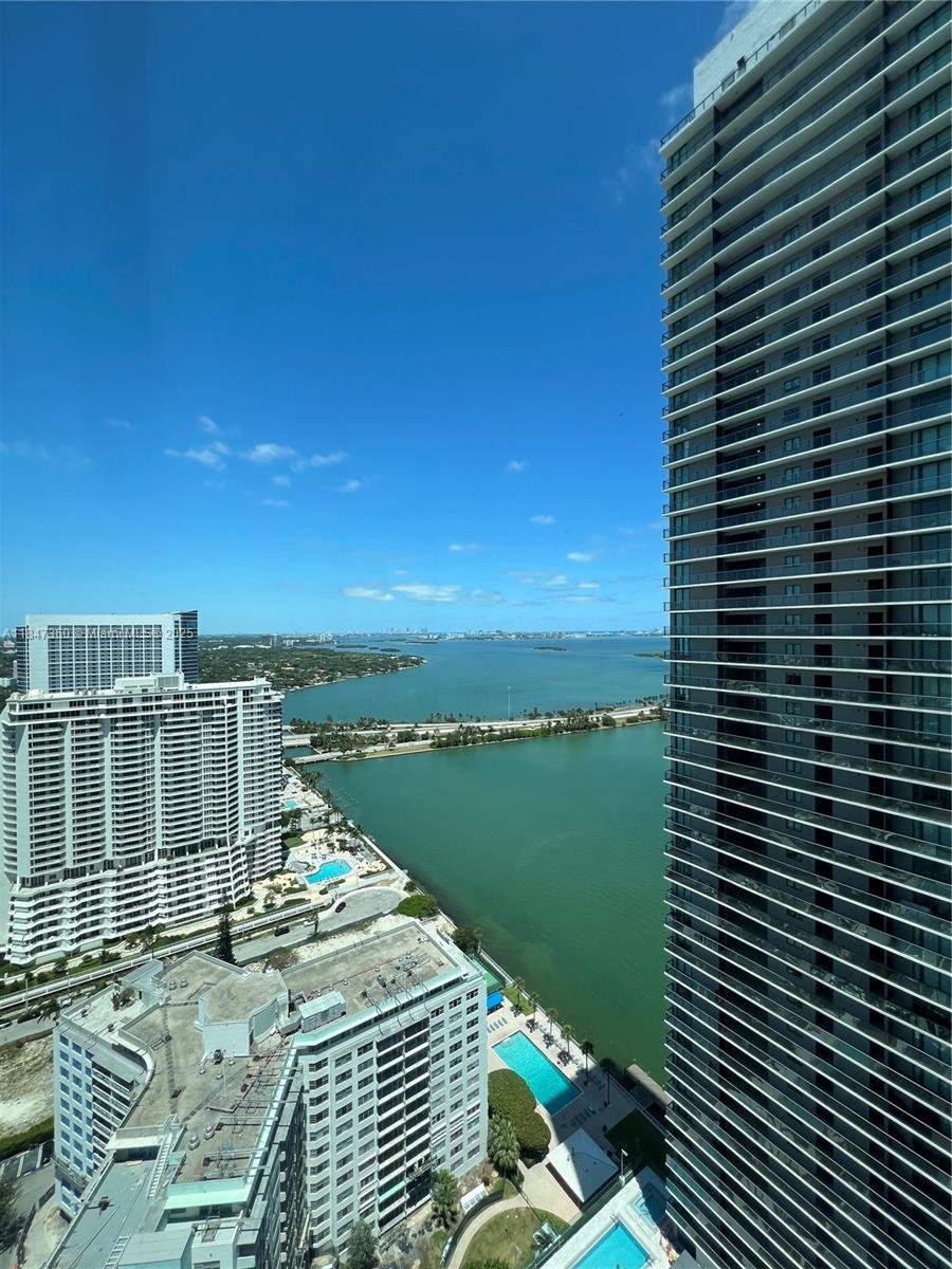 Enjoy this 1 BR + 1 1/2 BA with bay & city views at the Paraiso Bay in Edgewater. Living area with floor-to-ceiling windows all around. Enjoy any amenity you can think of ... 3-acre resort deck loaded with a zero-entry heated swimming pool, outdoor spa, poolside cabanas, summer kitchen, jogging circuit, gardens & landscaped sun terrace, clubroom with billiards, catering kitchen & multimedia facilities, gym, theatre, wine room, cigar lounge game room, children playroom, spa with steam & sauna, 2 tennis courts, golf simulator, bowling & multipurpose court! Not showing