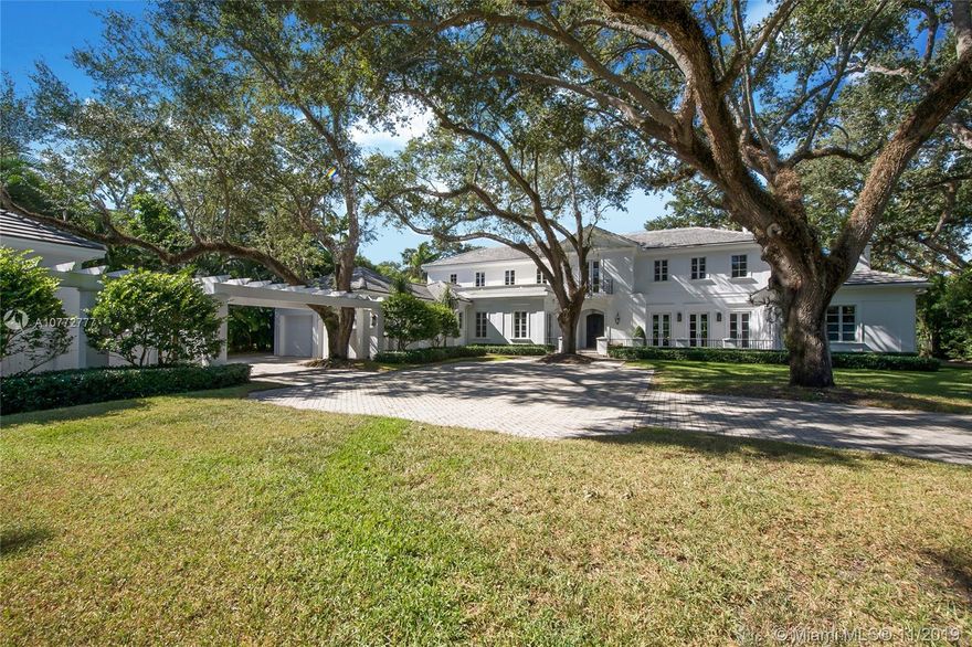 A grand, sprawling estate designed with a timeless aesthetic and elegant modern finishes. This extraordinary residence, located in the exclusive Stonegate gated community near Ponce Davis neighborhood, showcases meticulous luxury detail throughout its expansive floor plan and living spaces. Renovated in 2016, major upgrades include a new roof and eat-in kitchen fully equipped with top-of-the-line Wolf, SubZero and Miele appliances, Woodmode inset cabinetry, Waterworks hand-crafted backsplash and quartz counters. Large master suite with very spacious custom-made walk-in closets, a master bathroom with Waterworks tile, fixtures, soaking tub and Cesame pedestal sinks.