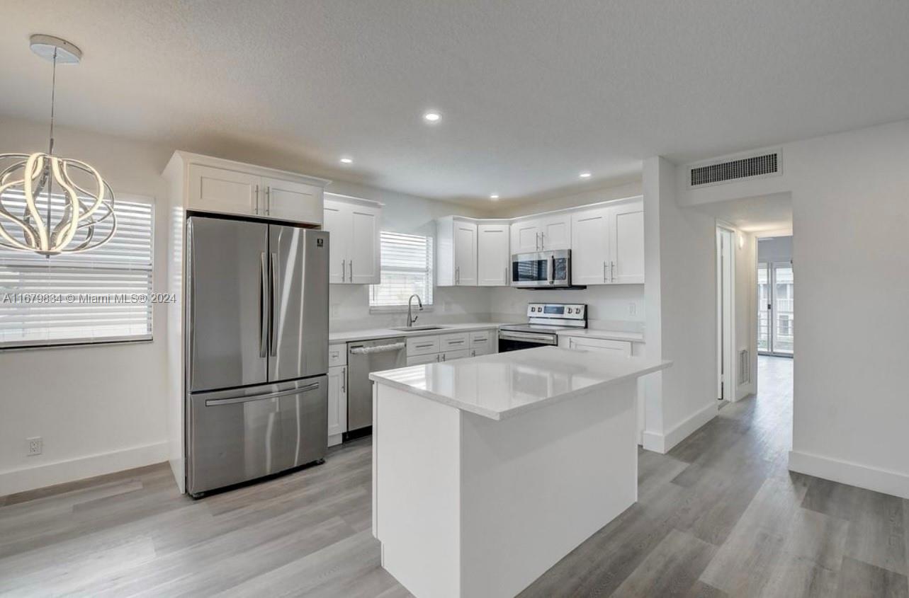 This beautiful remodeled 2-bedroom apartment boasts vinyl flooring throughout the entire space, fully-equipped modernized kitchen, quartz countertops, and top-of-the-line stainless steel appliances. Offering a spacious and open concept living area perfect for all your needs and entertainment. Both bathrooms have been fully updated with luxurious quartz vanities and showers. With a vast number of amenities, boredom is never in question ranging from tennis courts, pools, golfing, or a peaceful stroll. Come see your next home today!