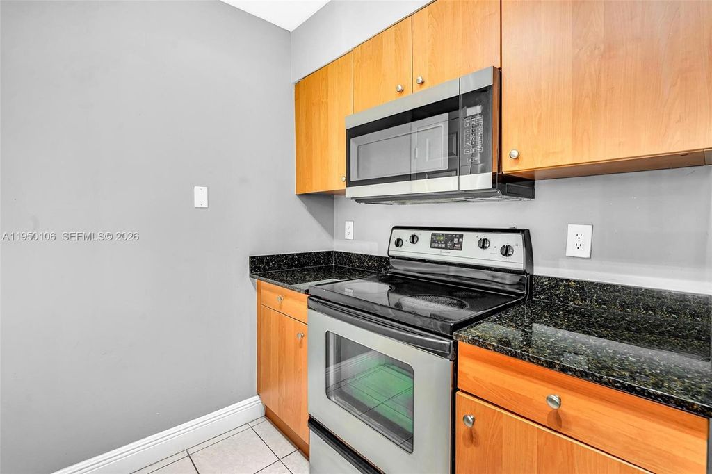 Photo of 2881 N Oakland Forest Dr #113, Oakland Park, FL 33309 (MLS # A11950106)