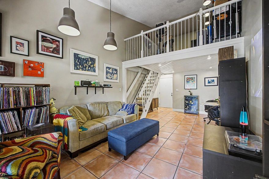 Well-maintained loft-style condo in the gated community of West Fontaine with 24/7 security, pool, and tennis courts. Excellent central location near FIU, Miami International Airport, Dolphin Mall, and quick access to the 836, 826, and Turnpike.

This bright second-floor unit features high ceilings, great natural light, and a versatile loft space ideal for a home office, guest room, or additional living area. Spacious private balcony perfect for relaxing, entertaining, or enjoying your morning coffee.

The primary suite includes a walk-in closet with custom shelving and a private bathroom. The second bathroom has been updated with modern tile, a waterfall shower, and built-in storage. The kitchen offers granite countertops, GE appliances, and a Whirlpool refrigerator. Separate laundry room with washer, dryer, and extra storage space.

Additional features include ceramic tile flooring, LED lighting, central A/C, fresh interior paint, and hurricane shutters.

A great opportunity for buyers looking for space, security, and value in a centrally located Miami community.