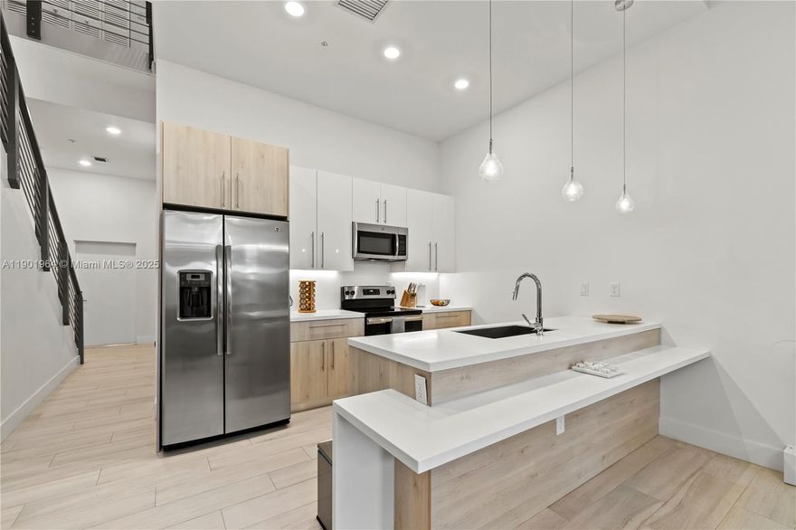 Experience luxury living in this stunning home featuring soaring high ceilings, modern finishes, and premium fixtures throughout. This elegant 2-bedroom, 2.5-bath residence offers an open-concept layout perfect for families and professionals alike. The bedrooms include custom built-in closets, while the primary suite features a spacious walk-in closet for added convenience and style. Enjoy your private backyard, ideal for entertaining or relaxing. Conveniently located just minutes from major highways, this home offers easy commuting and a peaceful neighborhood setting. Community amenities include a clubhouse with a resort-style pool, game area, and more, combining comfort and sophistication. Schedule your showing today!