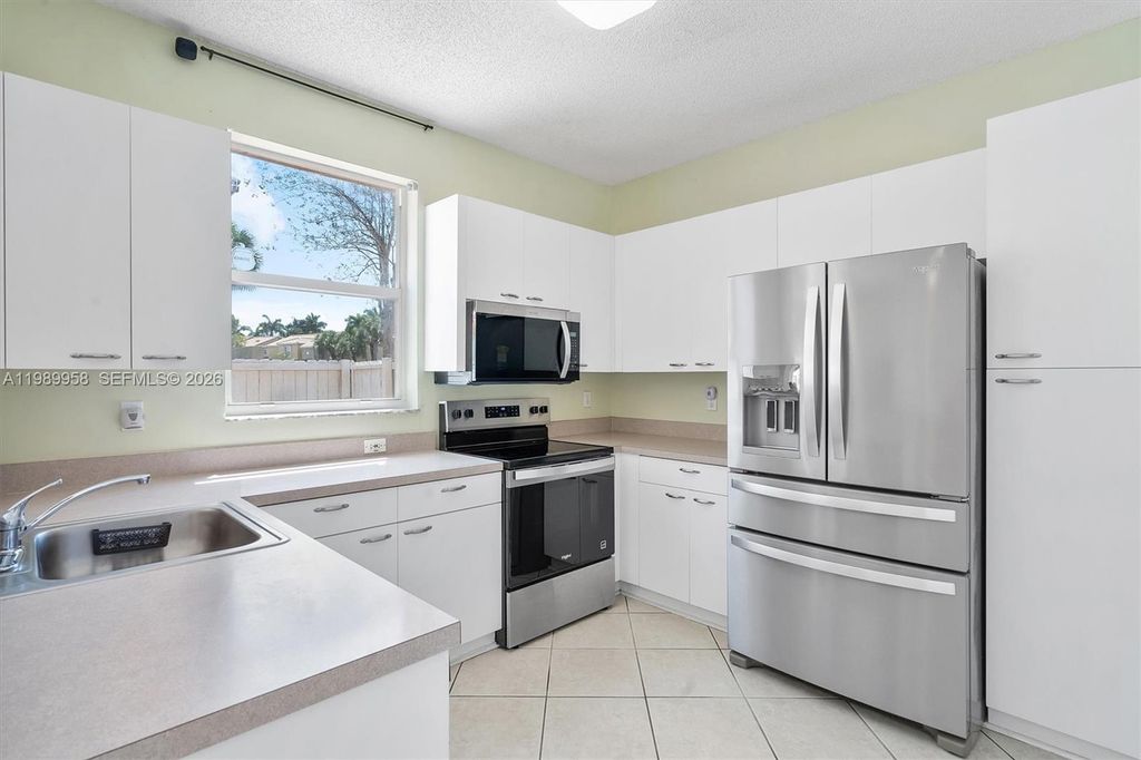 Photo of 15462 NW 14th Ct, Pembroke Pines, FL 33028 (MLS # A11989958)