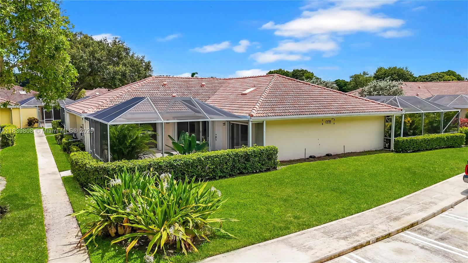 Freshly updated, this single-level 2BR/2BA residence showcases a thoughtfully designed split-bedroom layout with two private en-suite retreats—each opening via sliding glass doors to a sprawling 600+ sq ft screened lanai overlooking manicured green space. Interior highlights include brand new luxury vinyl plank flooring, vaulted ceilings, quartz countertops, stainless steel appliances and fresh neutral finishes throughout. A full-size washer/dryer, accordion hurricane shutters and exterior storage combine utility with peace of mind. Community features include a resort-style heated pool, clubhouse, two assigned parking spaces and ample guest parking. Ideally located near I-95, the Turnpike, Gardens Mall, WPB, Publix, Costco and more.