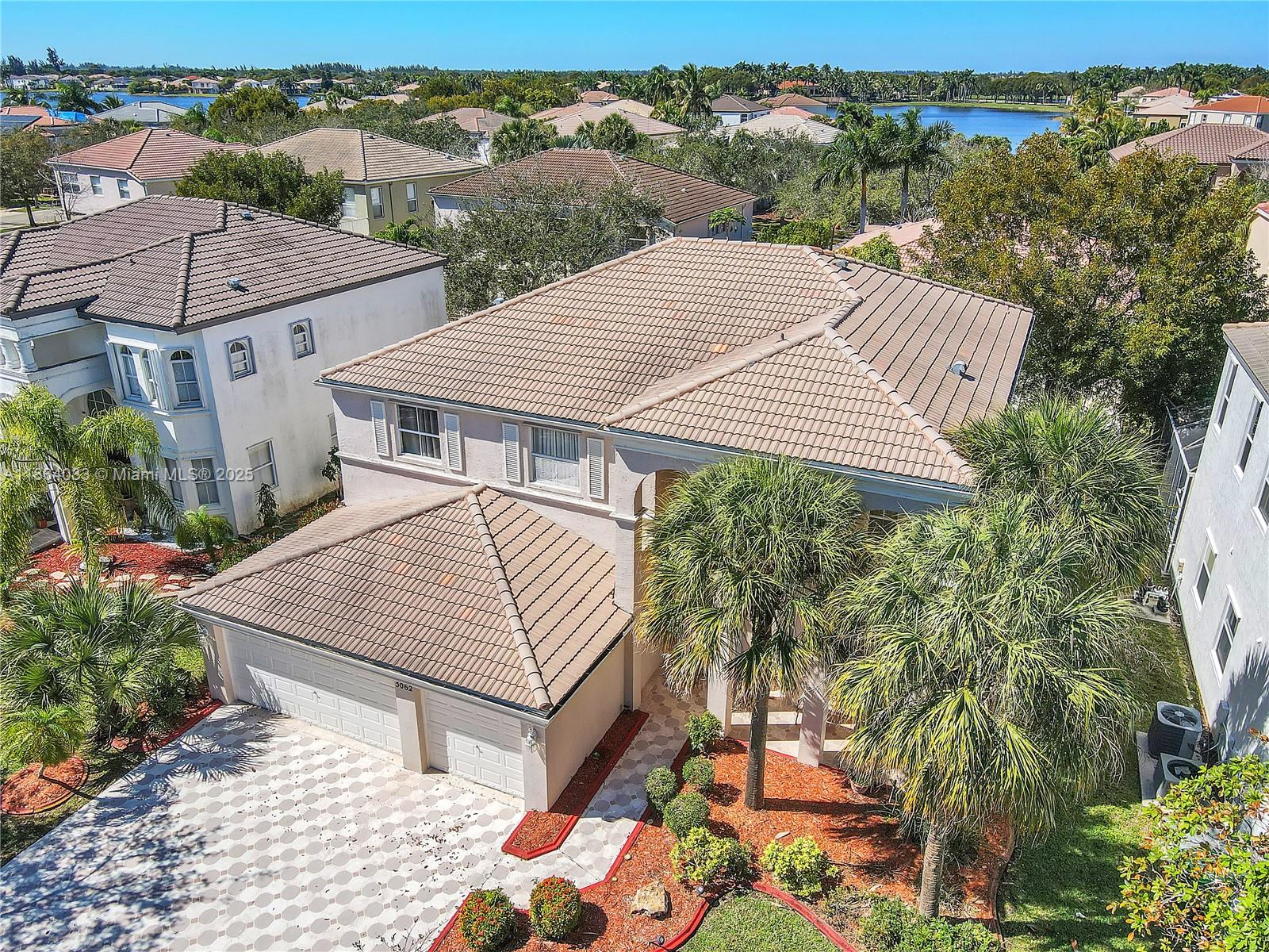 This impressive 5 bed/3 bath residence combines comfort, style, and functionality—perfect for family living and entertaining. Upon entry, you’re welcomed by a striking staircase leading upstairs and a bright Florida room to the right, ideal for gatherings or a cozy retreat. The expansive kitchen boasts custom cabinetry, a center island, and SS appliances, while the formal dining room provides an elegant space for hosting meals. The home features a spacious 3-car garage, ceramic tile flooring on the first level, and warm hardwood flooring throughout the second. The oversized master suite offers a serene escape with room for a sitting area, an expansive WI closet with custom built-ins, and a spa-inspired ensuite bath complete with dual vanities, a WI shower, and a luxurious whirlpool tub.