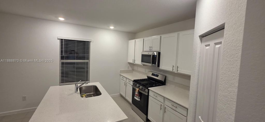 Photo of 6315 NW Windwood Way, Port St Lucie, FL 34987 (MLS # A11888870)