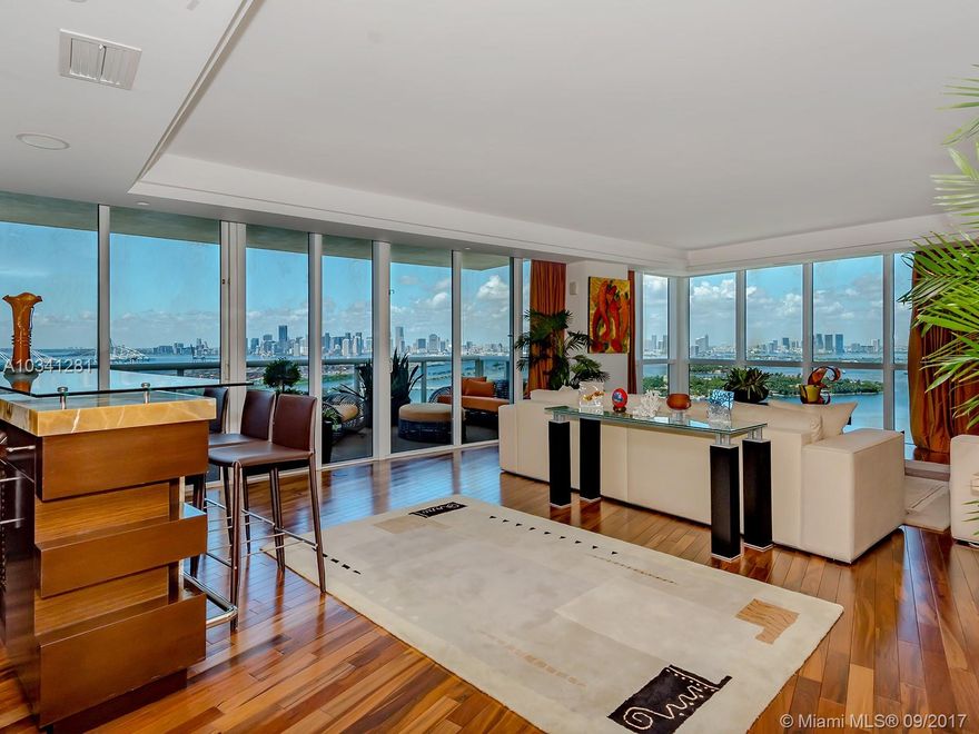 Beautiful ocean and bay views including Downtown skyline, from this 3979 square Ft flow through unit. Private elevator entry, 3 large balconies great for entertaining. Hardwood floors, marble countertops, onyx wall, Sub Zero refrigerator. Top of the line amenities which include, state of the art gym, pool and tennis court. Great location near the ocean, restaurants, shopping and Miami Beach Marina.