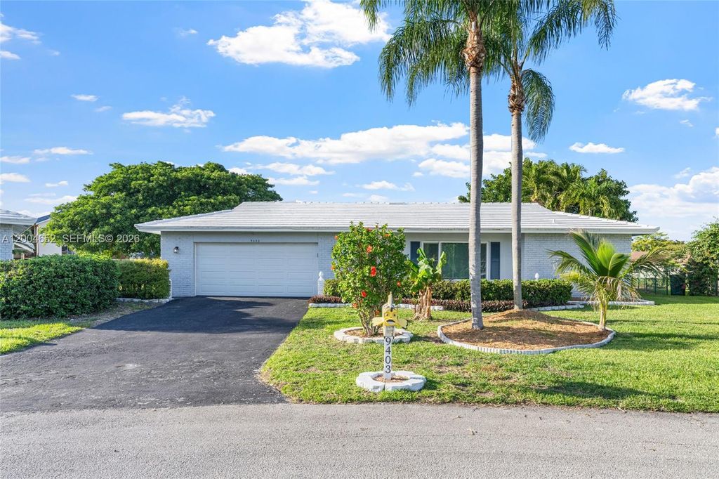 Photo of 9403 NW 74th Pl, Tamarac, FL 33321 (MLS # A12004652)