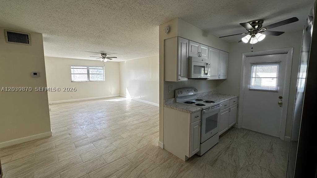 Photo of 7480 SW 10th St #202A, North Lauderdale, FL 33068 (MLS # A12039870)