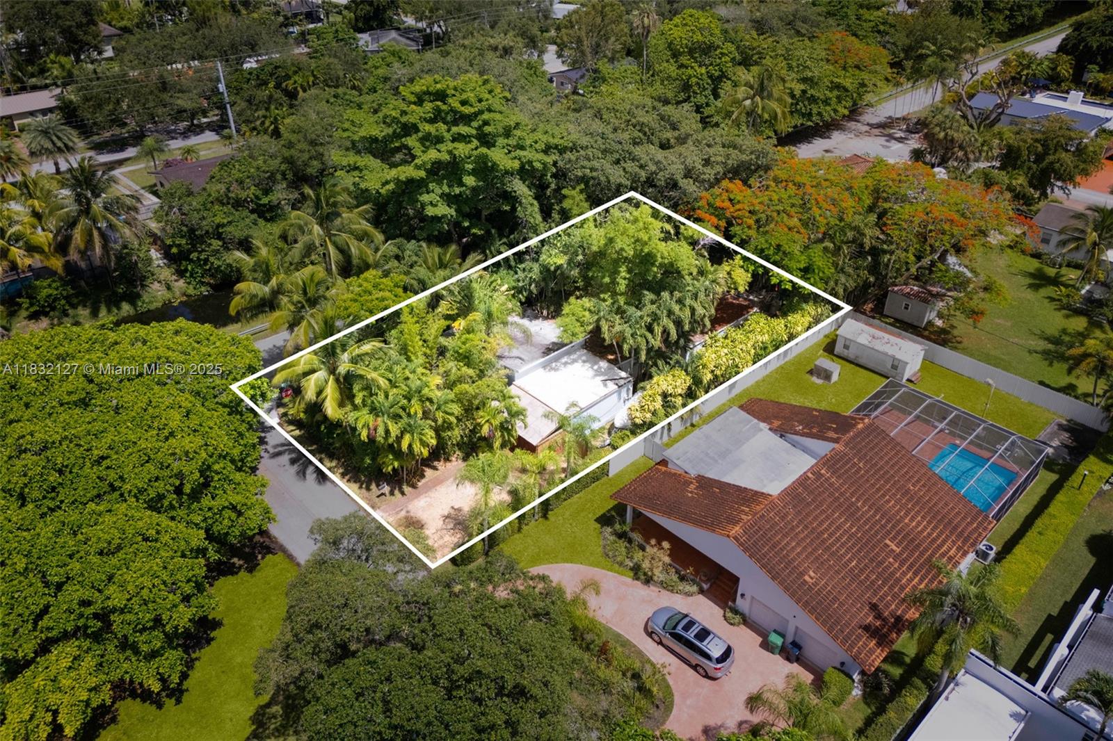 Nestled in a prime South Miami location, this expansive 10,000 SF corner lot offers exceptional potential. Just minutes from the soon-to-be-redeveloped Sunset Place, the University of Miami, and South Miami Hospital, this property combines convenience with opportunity. Directly across from the serene and picturesque Fuchs Park, the setting is ideal for those seeking tranquility with urban proximity. The existing structure features a 2-bedroom, 2-bathroom layout with a spacious family room—perfect for renovation or as a foundation for a brand-new dream home that fully capitalizes on the lot’s generous size and premier corner position. Whether you're an investor, builder, or end-user, this is a rare chance to secure a valuable piece of South Miami. Easy to show—schedule your visit today.