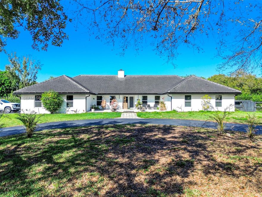 Welcome to a rare opportunity in the heart of Davie! Situated on a prime corner lot over an acre, this beautifully maintained property offers the perfect blend of space, functionality, and lifestyle. The main home features a thoughtfully designed layout with a private office, gym, and game room ideal for both everyday living and entertaining. Along with 5 bedrooms! 

The recently remodeled kitchen showcases modern finishes and flows seamlessly into the living areas, while impact windows and doors provide peace of mind throughout. A 5-year-old roof adds to the home's overall value and condition.

Step outside to your private backyard oasis, complete with lush landscaping, a screened-in pool, covered patio, and a fully equipped outdoor kitchen perfect for entertaining. The expansive lot also features a large detached shop, ideal for car enthusiasts, business use, storage, or even accommodating animals.

Additional highlights include a circular driveway, dedicated slabs for RV and boat parking, and a 200’ well water system.