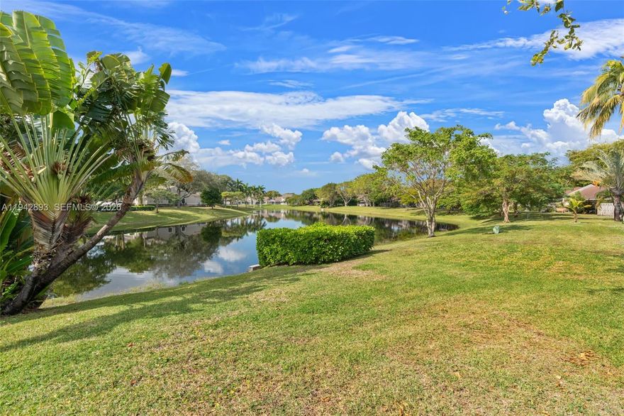 Own your slice of paradise!  This water front 2 bedroom/2 bathroom fenced yard ALL AGES and PET FRIENDLY community is where you want to be.  The fenced yard has a variety of fruit trees for your enjoyment.  Beautifully renovated kitchen with white shaker cabinets, gorgeous quartz counter tops and stylish new backsplash.  RAINSOFT water system installed. Stainless steel appliances round out this  light bright chefs kitchen.  Large living and dining space with vaulted ceilings to add a touch of grandeur. Both bedrooms have their own updated en suite bathroom and walk in closets.  Each room has tons of natural light pouring in through the windows all of which have accordian shutters.  Step out onto your screened patio to enjoy million dollar sunsets.  There's a laundry room and storage closet on the patio as well.  There is a 30 AMP HOME GENERATOR plug in ready for when the power goes out.  Your family will enjoy the heated pool, children's playground, clubhouse and tennis.  You're close to shopping, I-95 and Turnpike!  AC 2013  Water Heater 2023