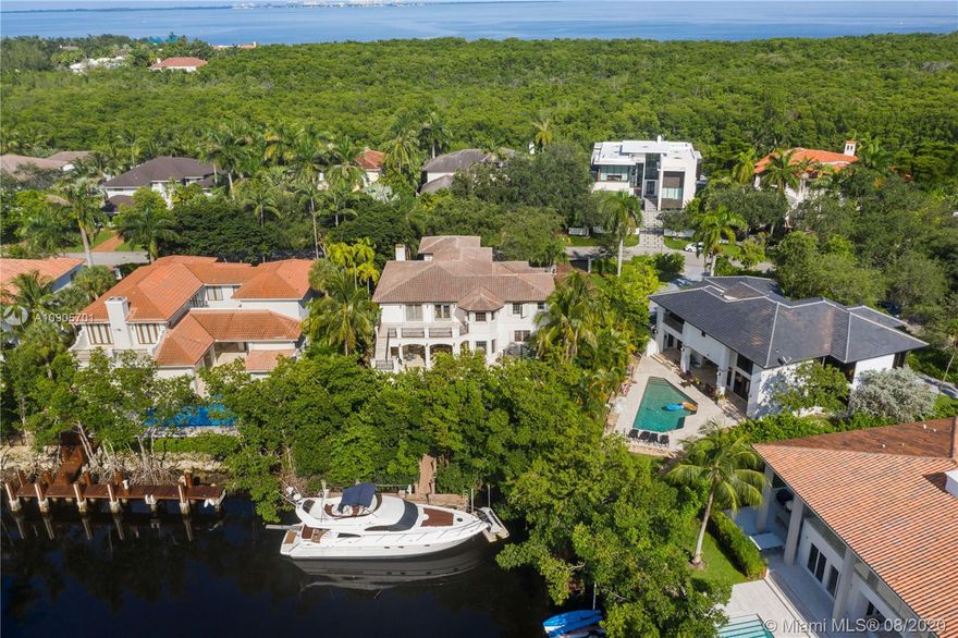 Mediterranean, timeless two-story waterfront in one of Miami’s most prestigious neighborhoods. Fits a 60ft yacht,1 bridge to bay, boating double height ceilings, elegant LVG rm & floating staircase, warm finishes from marble, travertine & mahogany finishes throughout; all bedrooms are en-suites, all 7.5 baths are tastefully remodeled, space to add an elevator, chef’s kitchen, grand family room opens up to the covered terrace, pristine pool & spa surrounded by lush foliage making an excellent space for private entertainment w/ a tropical pathway to your boat! 2nd floor has 4 suites including the grand master suite w/ expansive terrace & staircase to the pool; 3 car garage & maid’s quarters! Cocoplum is a gated 24hr security enclave offering a clubhouse, t-courts, gym, B-ball & a playground!