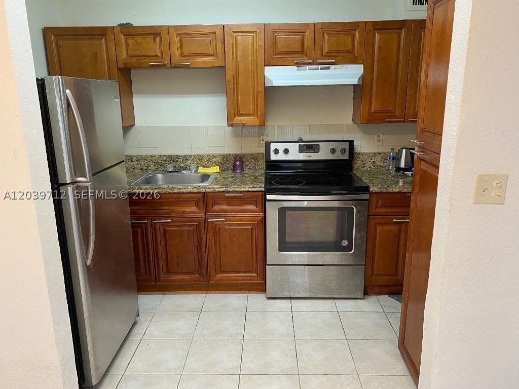 Photo of 4717 SW 33rd Ave #102, Dania Beach, FL 33312 (MLS # A12039712)