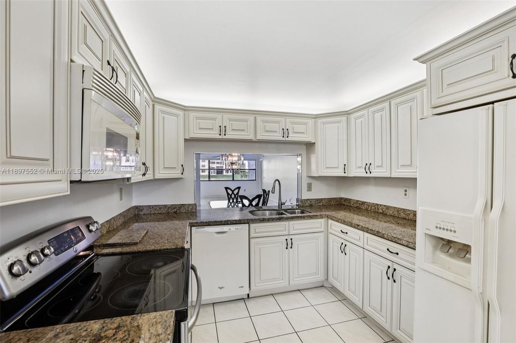 Photo of 2981 N Nob Hill Rd #108, Sunrise, FL 33322 (MLS # A11897552)