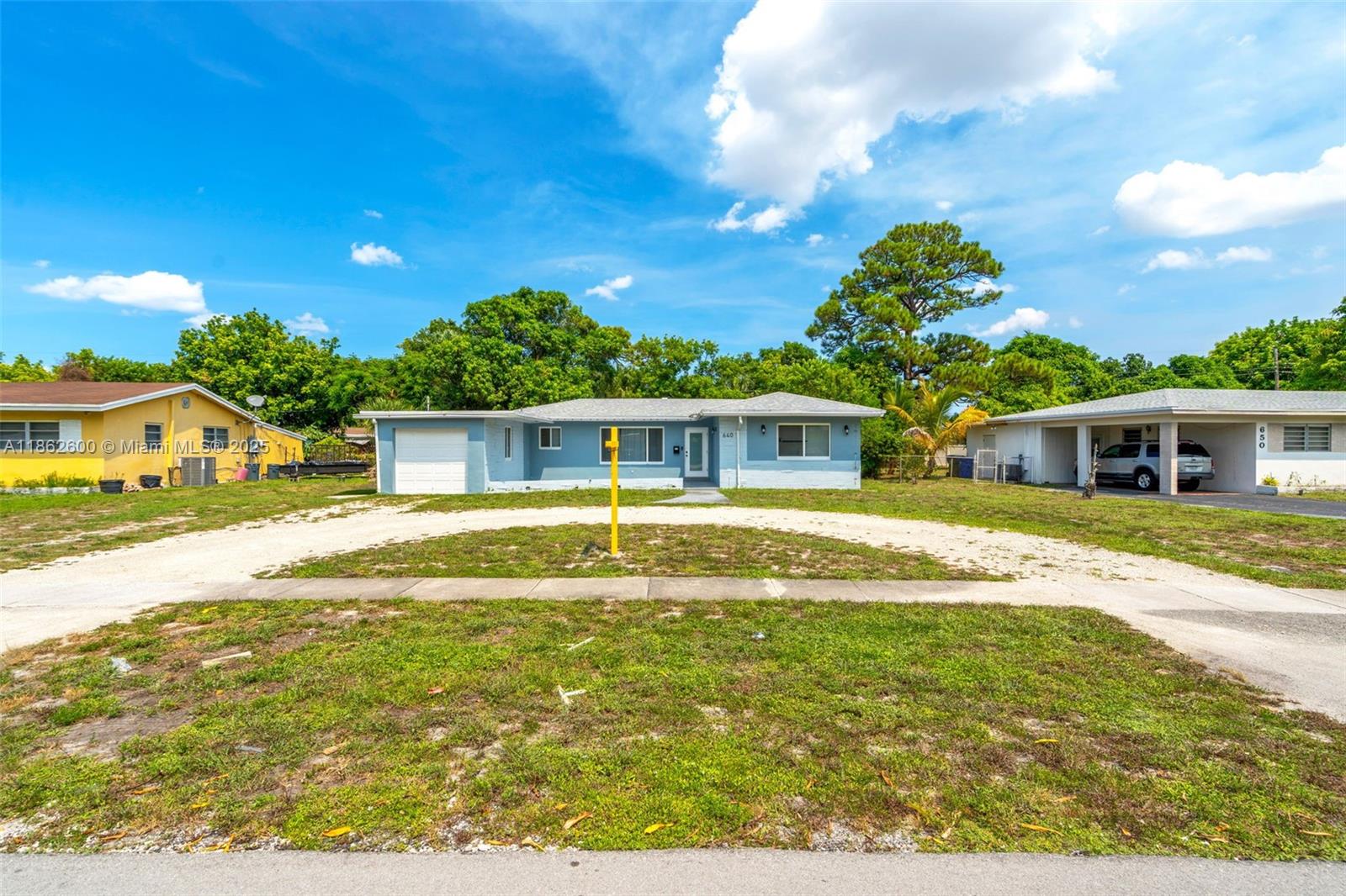 This modern, move-in ready 3-bedroom, 2-bath single-family home sits on an oversized 11,451 sq ft lot in a quiet neighborhood. Majority of the updates were completed in 2022, featuring high-shine tile flooring, quartz countertops, stainless steel appliances, recessed lighting, and fully remodeled bathrooms. The roof was replaced just 3 years ago. A extra utility/storage room adds versatility, featuring a laundry area and ceiling fan. The garage door has been sealed from the inside (not converted), offering extra usable space while maintaining the home’s original exterior. Located just 8 minutes from I-95, 18 minutes to Fort Lauderdale Airport, and 21 minutes to Las Olas Beach—with shopping and dining close by—this turnkey home offers modern living in a prime location.