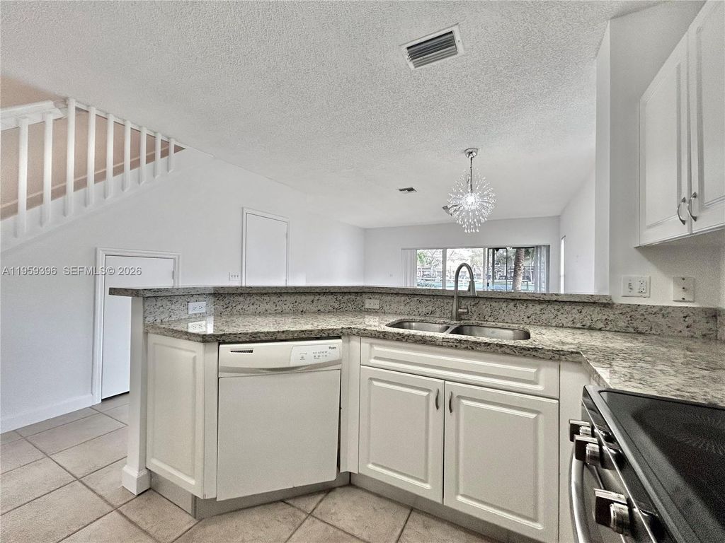 Photo of 12161 SW 4th St #1, Pembroke Pines, FL 33025 (MLS # A11959396)