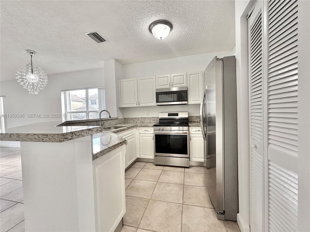 Photo of 12161 SW 4th St #1, Pembroke Pines, FL 33025 (MLS # A11959396)