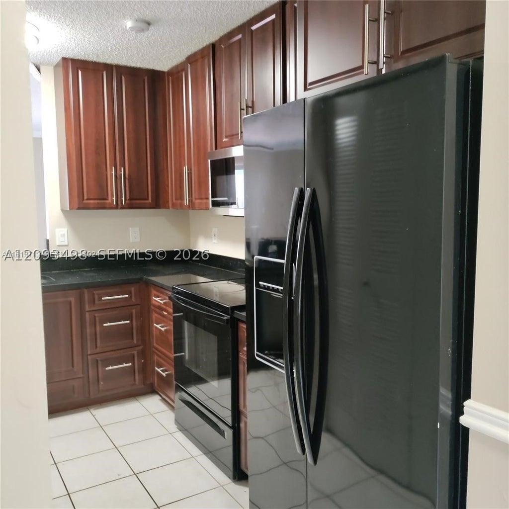 Photo of 609 NW 109th Ave #0, Pembroke Pines, FL 33026 (MLS # A12093498)