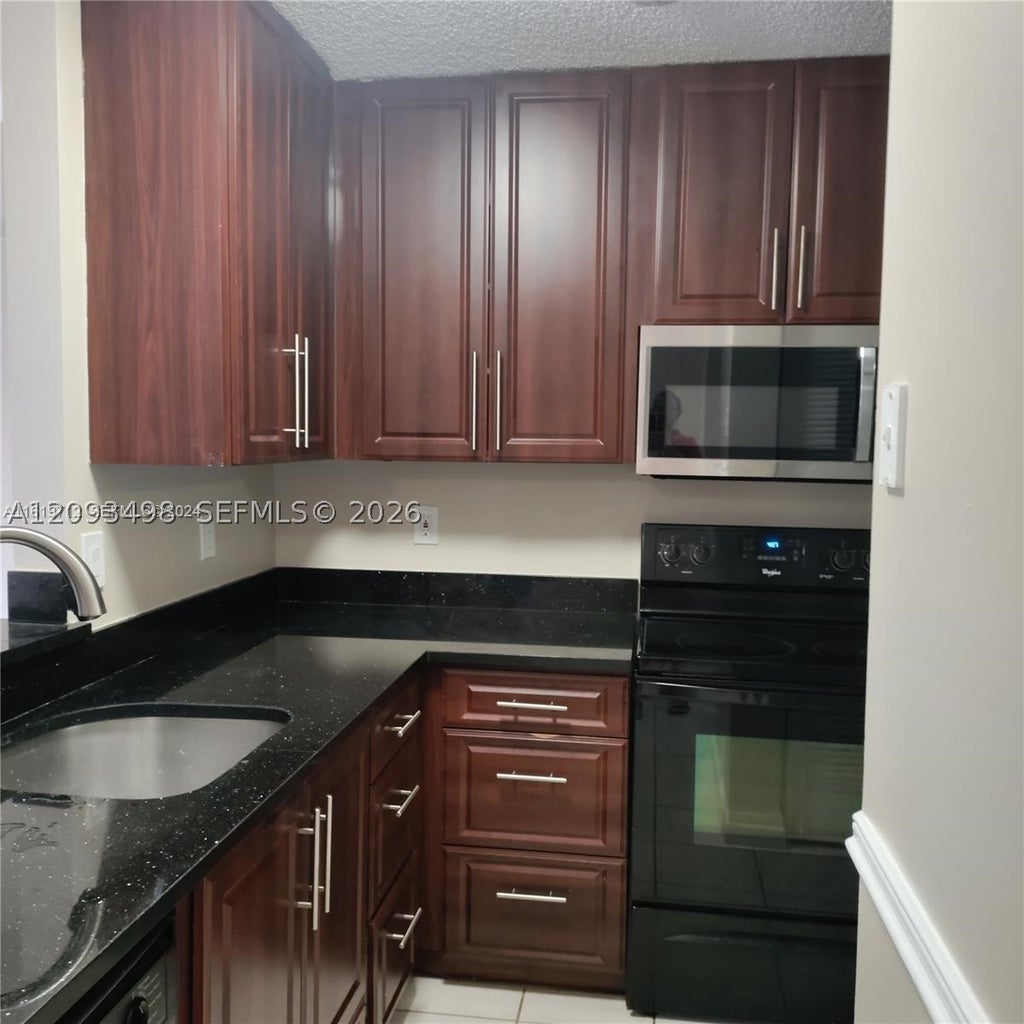 Photo of 609 NW 109th Ave #0, Pembroke Pines, FL 33026 (MLS # A12093498)