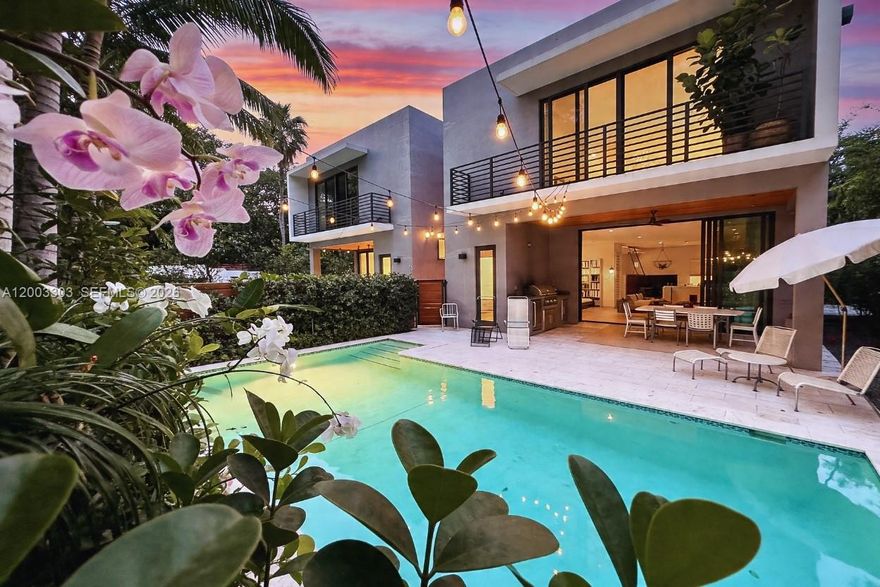 A rare gem in Coconut Grove! Freestanding luxury townhome nestled alongside a neighborhood park — an enchanting oasis unlike anything else on the market. Solar-powered & set on the largest duplex parcel, just ½ block from Blanche Park & 3 blocks to CocoWalk. Come on in, the living is easy! Impeccably finished, wide-open floor plan bathed in natural light, anchored by the Venete Cucine kitchen. The celebration continues outdoors — covered terrace, summer kitchen, al fresco dining & 16x30' pool where every gathering finds its perfect setting in paradise. Five ensuite bedrooms include 1st floor BR suite for guests/home office and the Primary suite upstairs — tranquil sanctuary with treetop balcony & Zen-inspired bath. Seclusion, sophistication & space. Come for the location. Stay for everything else.