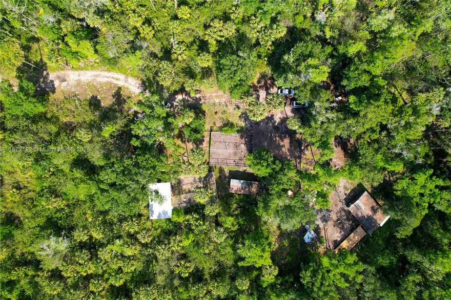 Situated on 2.5 ACRES in the heart of GOLDEN GATE ESTATES, this property offers a rare opportunity to enjoy a peaceful, RURAL LIFESTYLE with a head start on your vision. Zoned for SINGLE-FAMILY RESIDENTIAL use, with the added benefit of allowing a GUEST HOUSE, the land has already been thoughtfully CLEARED and PARTIALLY FENCED, with several FUNCTIONAL ANIMAL STRUCTURES and a variety of MATURE FRUIT TREES in place — ideal for those looking to start a GARDEN, tend to SMALL-SCALE AGRICULTURE, or simply enjoy the OPEN SPACE. With an ESTABLISHED LAYOUT, the property is well-prepared for a future HOMESITE. NO HOA and plenty of flexibility to BUILD, GROW, or HOLD FOR THE FUTURE.