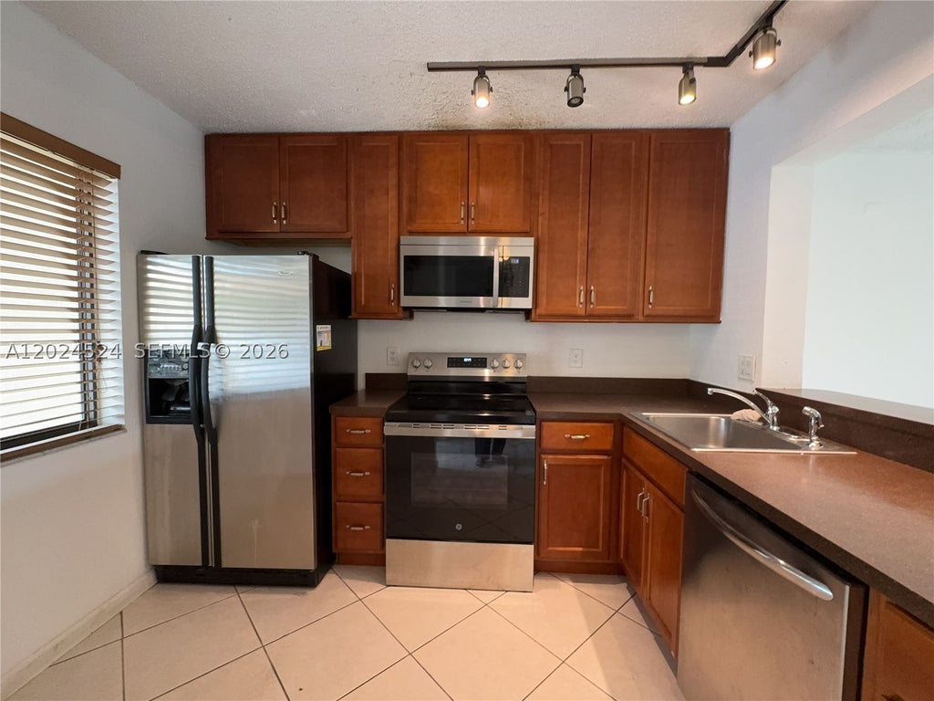 Photo of 6552 Arleigh Ct #102, Boca Raton, FL 33433 (MLS # A12024524)