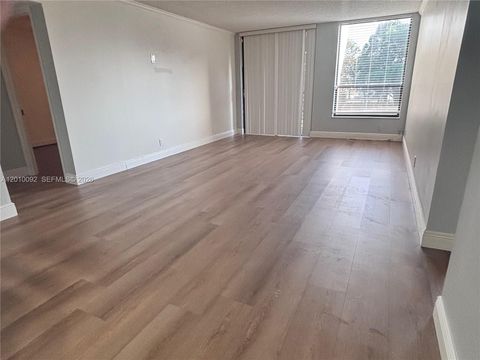 Photo of 8050 W Mcnab Rd #212, Tamarac, FL 33321 (MLS # A12010092)