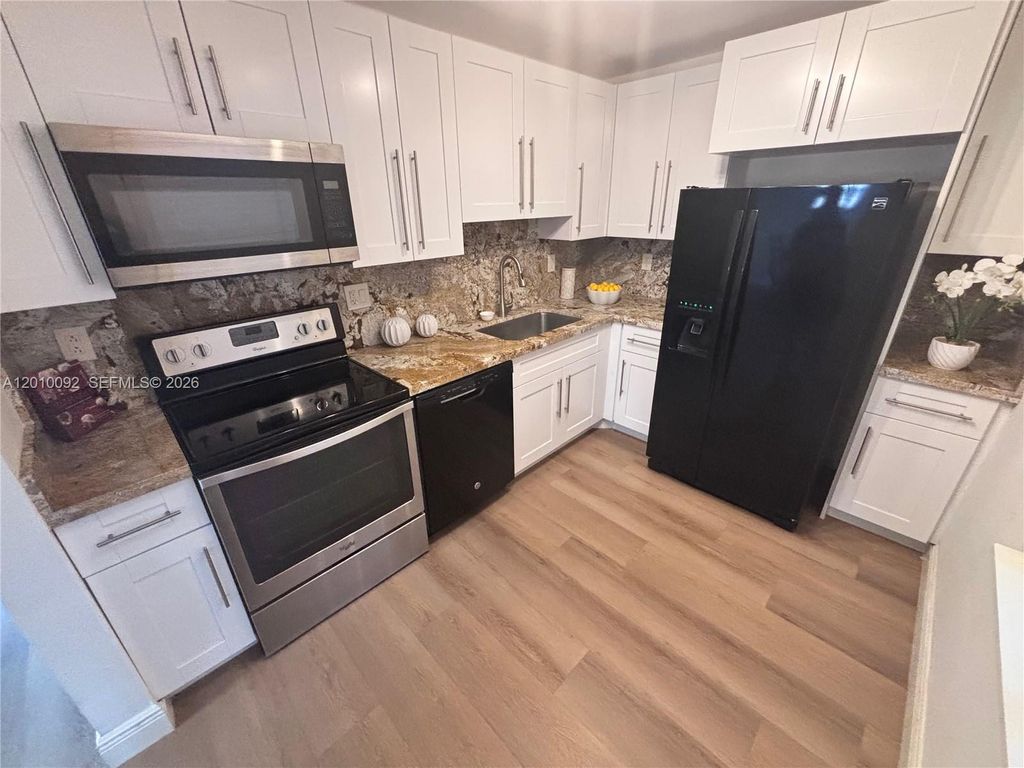 Photo of 8050 W Mcnab Rd #212, Tamarac, FL 33321 (MLS # A12010092)
