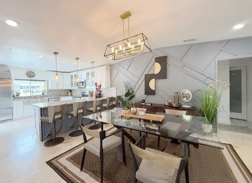 Modern open-concept 3BD/2BA townhome with garage that lives and feels like a single-family home, featuring vaulted ceilings and a bright, spacious layout with over $200,000 in upgrades and pride of ownership throughout. Marble and tile flooring, custom frosted interior doors, impact windows and doors, and high-end finishes complement the gourmet white eat-in kitchen with stainless steel appliances, sleek countertops, and solid wood cabinetry, along with a formal dining area and expansive living space ideal for entertaining. A rare extra-large custom driveway accommodates large vehicles or up to three cars in addition to the garage, which is finished with A/C and marble flooring and offers ample storage. Additional upgrades include a new A/C handler, new water heater, 220 electric vehicle charger, new washer and dryer, Ring cameras, and modern comforts including bidet toilets. Enjoy a private tiled patio and fully fenced backyard, located in the well-maintained Lakewood on the Green community offering a clubhouse, pool, fitness center, tennis courts, BBQ areas, and landscaped grounds. Low HOA includes cable, internet, lawn maintenance, and exterior painting, with convenient walking distance to Applebee’s and Walmart, and easy access to shopping, dining, SR-441, Florida’s Turnpike, and Fern Forest Nature Center.