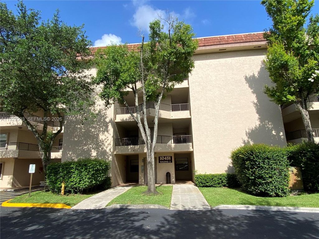Photo of 10451 W Broward Blvd #405, Plantation, FL 33324 (MLS # A11929393)